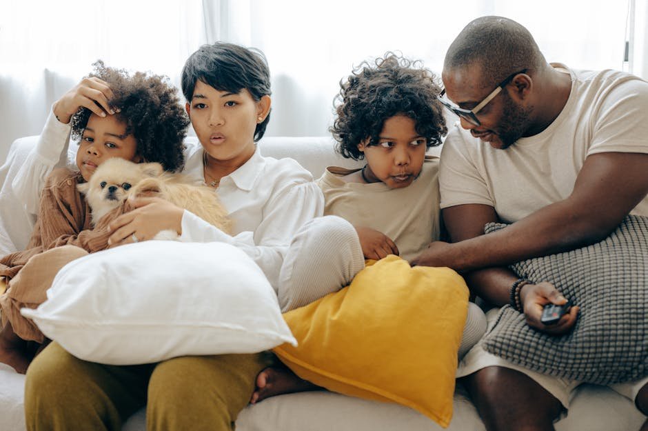 Family watching high-quality IPTV streaming on multiple devices in UK living room