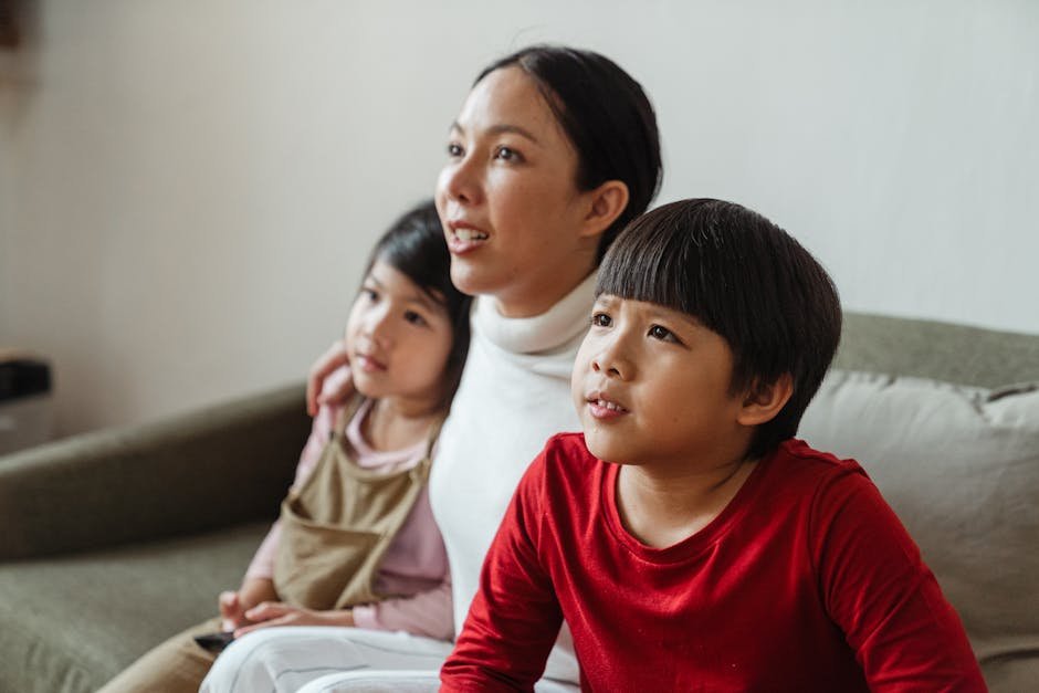 Happy family enjoying Strong 8K IPTV streaming on their smart TV with perfect picture quality